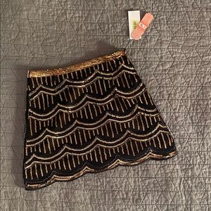 Black and gold sequin mini shirt